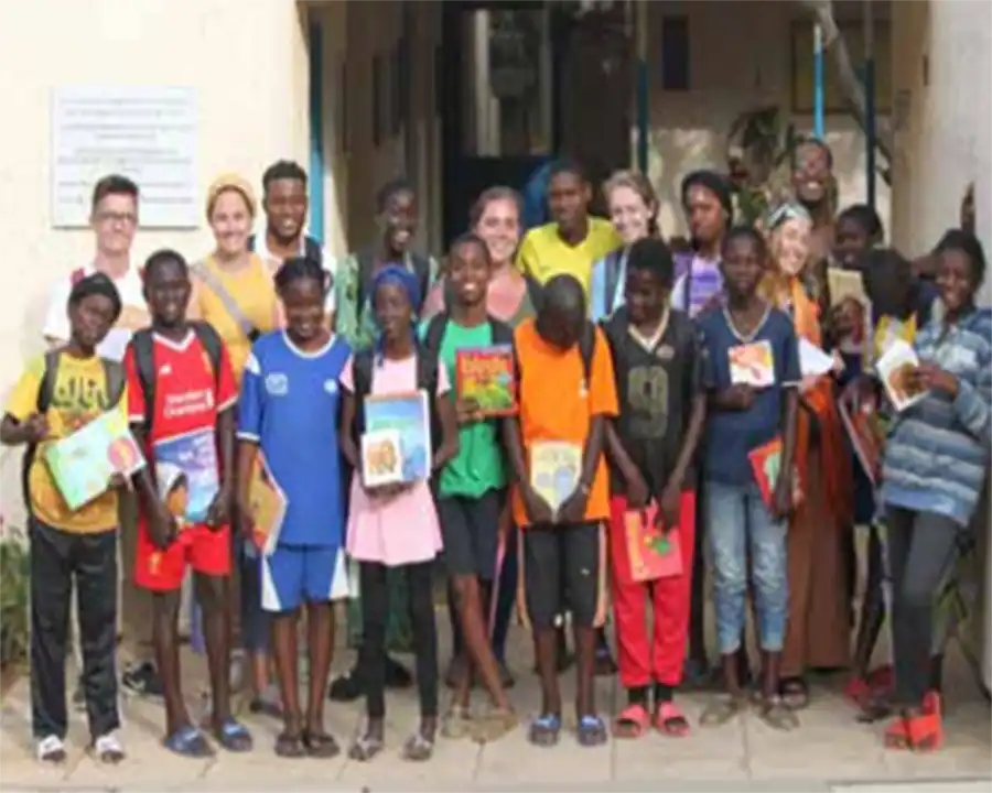 A photo of UT Africana Studies students with students in Ghana.
