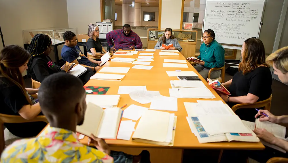 Dr. Shaneda Destine, Assistant Professor in the Department of Sociology and the Department of Africana Studies, holds class in the Special Collections section of John C. Hodges Library on March 14, 2019. Photo by Steven Bridges