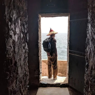 Corey A. Hodge stands at the Door of No Return on Goree Island, where enslaved Africans would be loaded onto boats to cross the Atlantic.